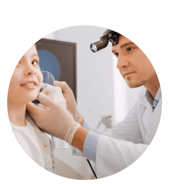 An ENT specialist using a medical instrument to clean out a child's ear at Houston ENT and Allergy clinic