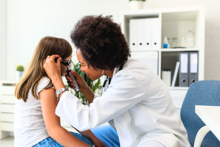 Houston Ear Doctor at Houston ENT & Allergy examining patients ear