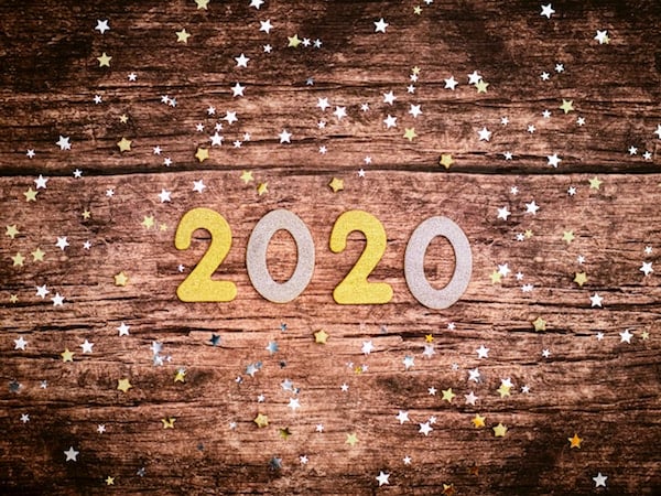 2020 made of shiny paper on a wood background