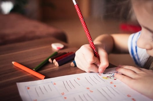 child doing work in a classroom