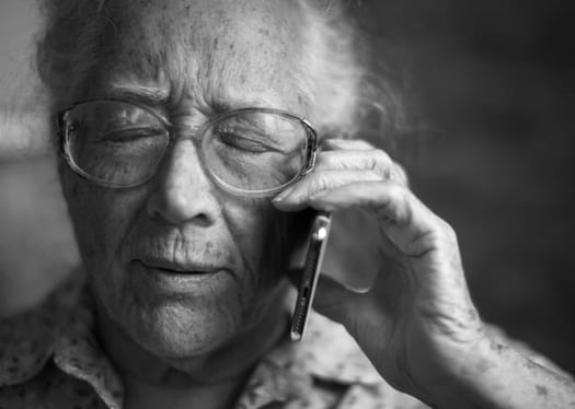 Man struggling to talk on the phone 