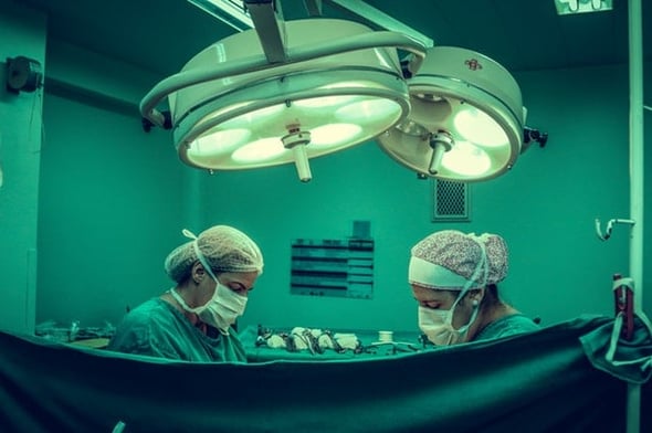 doctors performing surgery 