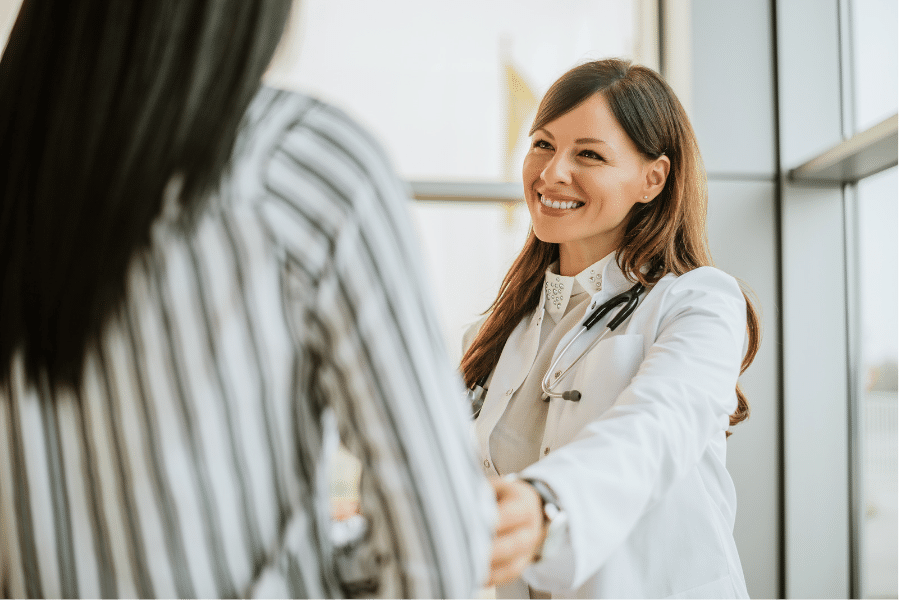 An ENT specialist displaying compassion towards her patient at Houston ENT and Allergy clinic